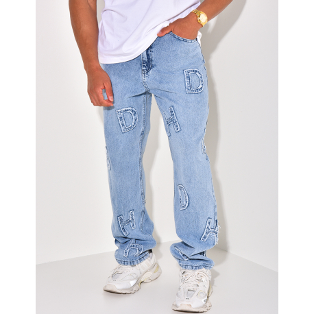 Jeans coupe large avec lettres en relief