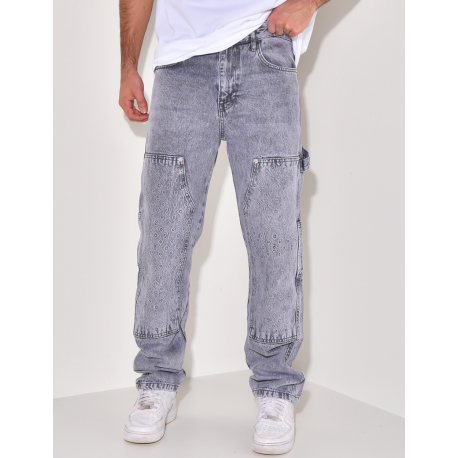 Jeans avec empiècements à motifs en relief