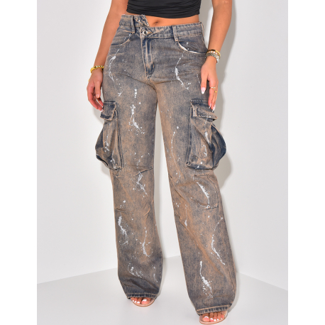 Cargo jeans with rust-effect paint stains and asymmetrical button hole