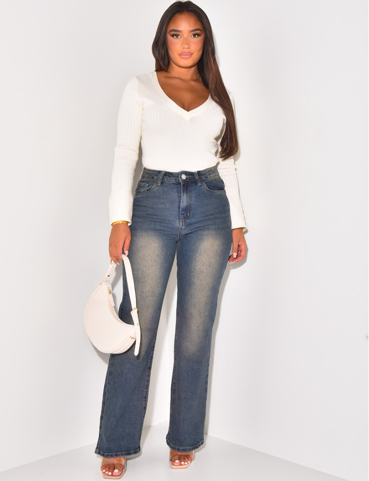 High-waisted jeans, faded wide cut