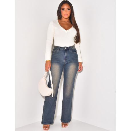 High-waisted jeans, faded wide cut