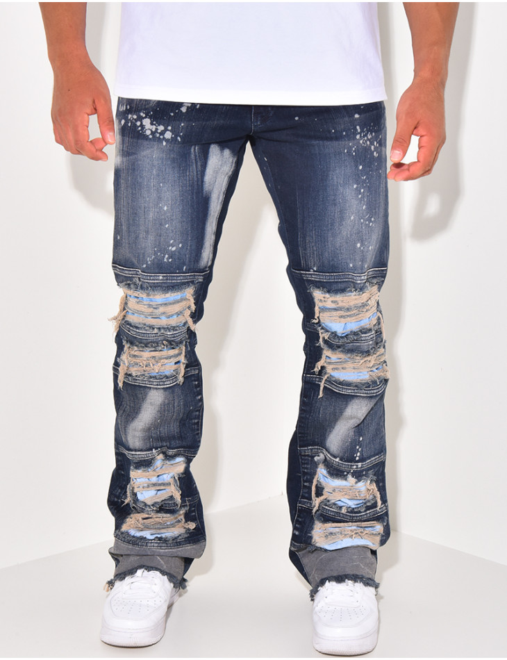 Destroyed jeans with paint stains