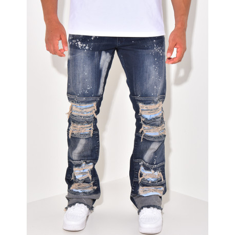 Destroyed jeans with paint stains